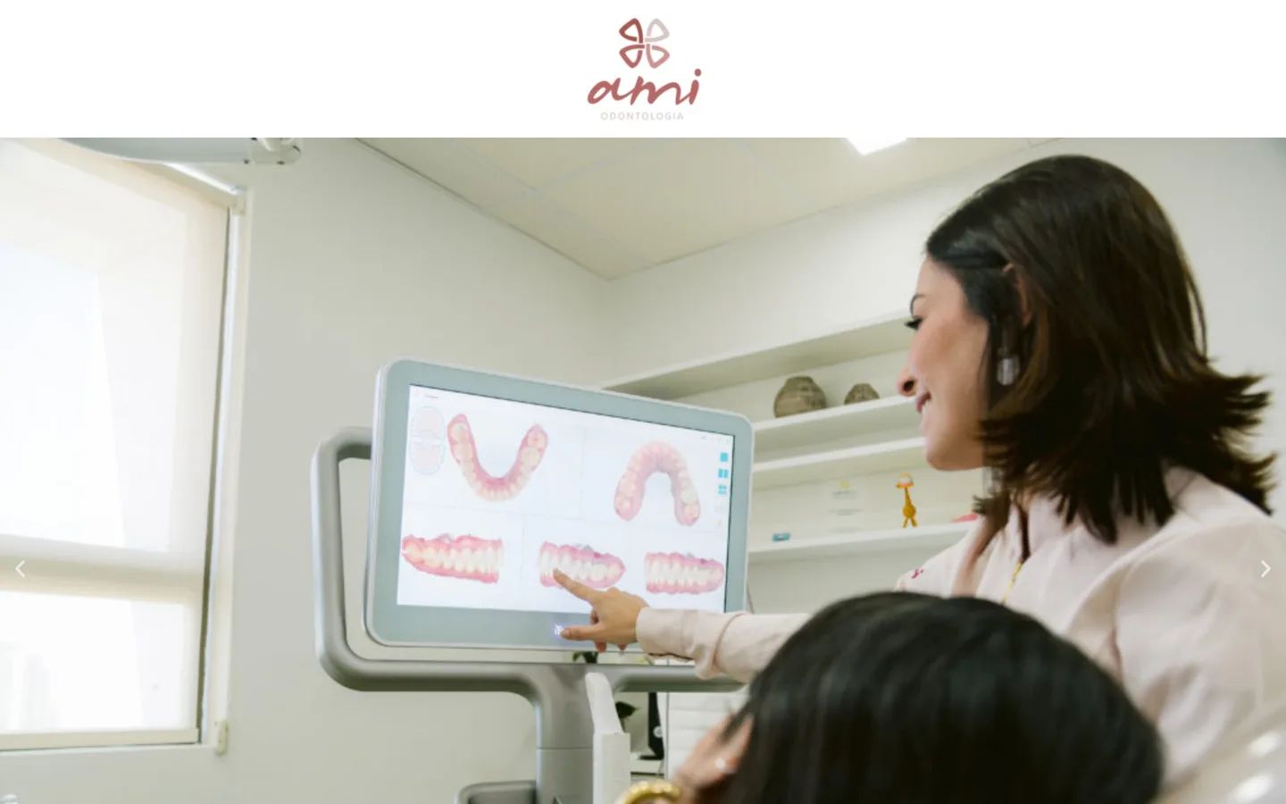 Home da AMI Odontologia no desktop: logotipo, foto do atendimento com escaneamento digital e chamada para os tratamentos.